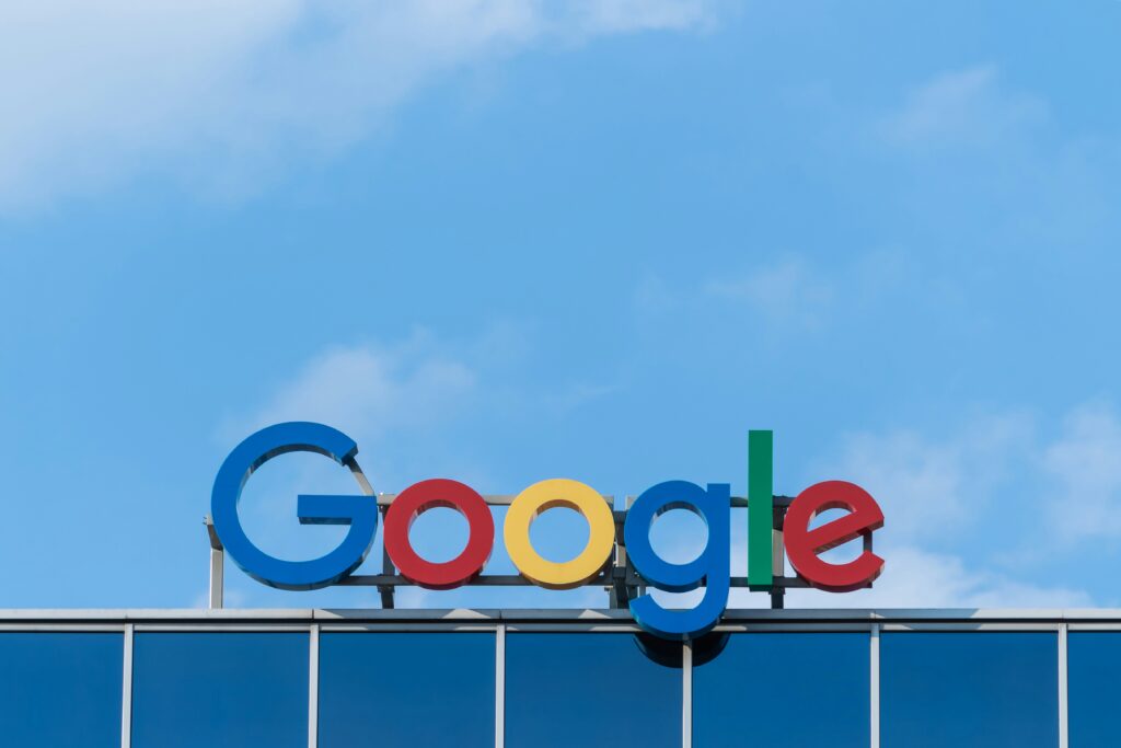 Blue sky with the Google sign on top of the building in San Francisco.
