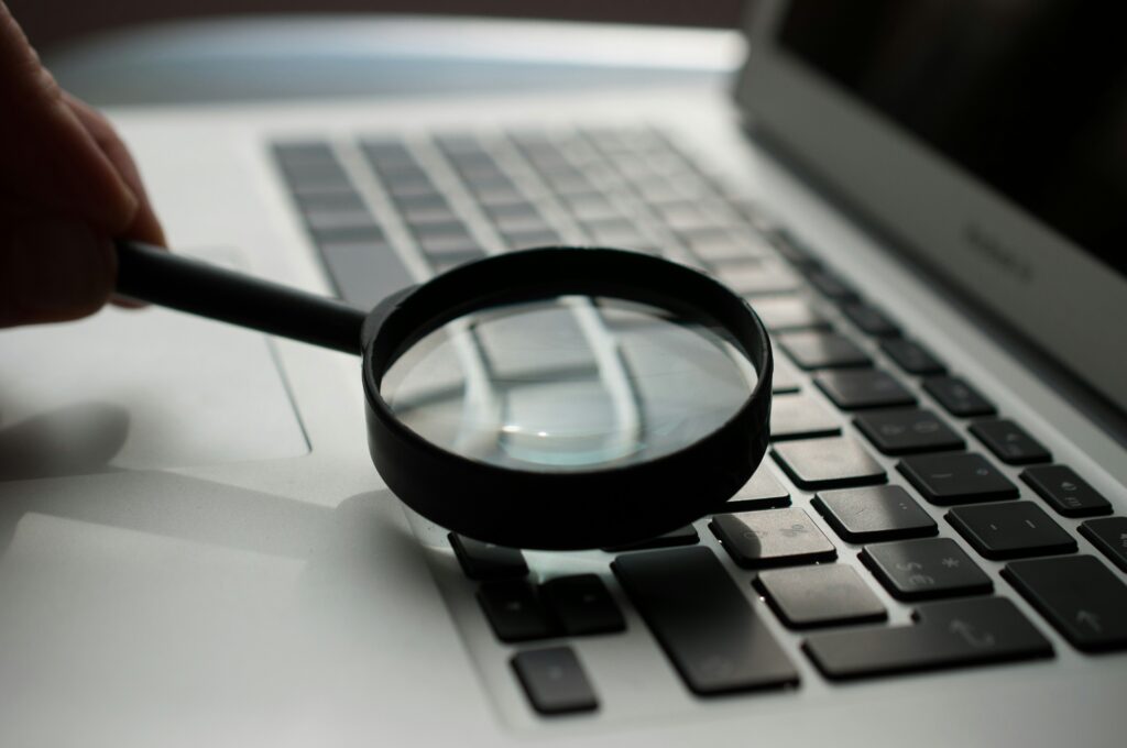 Magnifying glass on keyboard.
