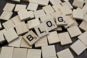 Wooden Scrabble board letters that say BLOG.